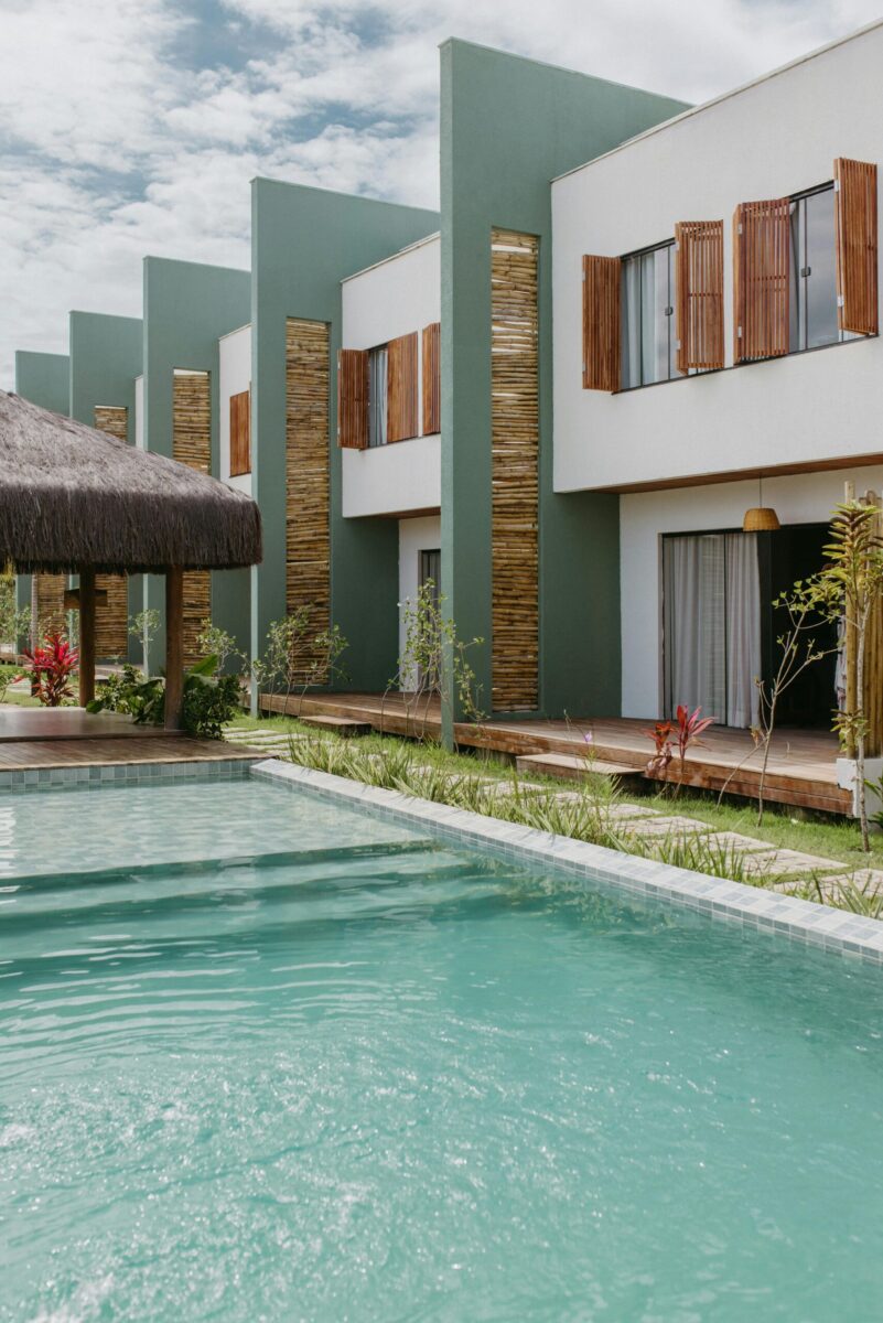 Stunning modern villa with a pool and garden in Bahia, Brazil under a clear sky.